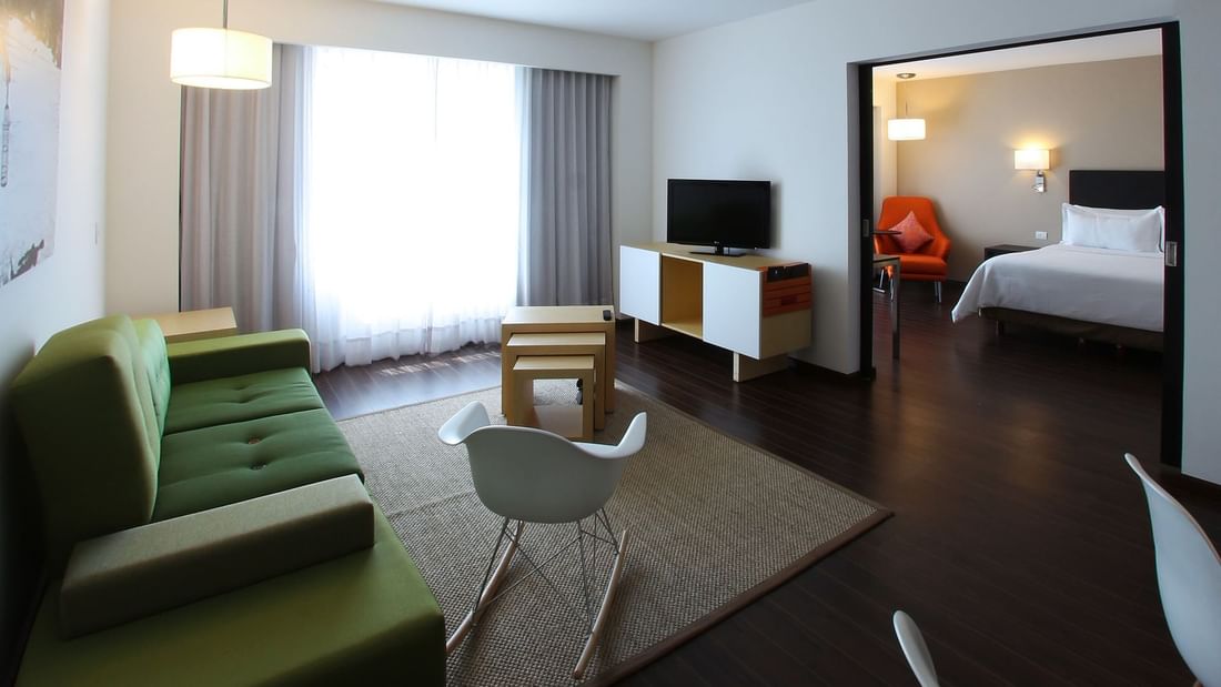Interior of Junior Suite with Tv & loungers at Fiesta Inn