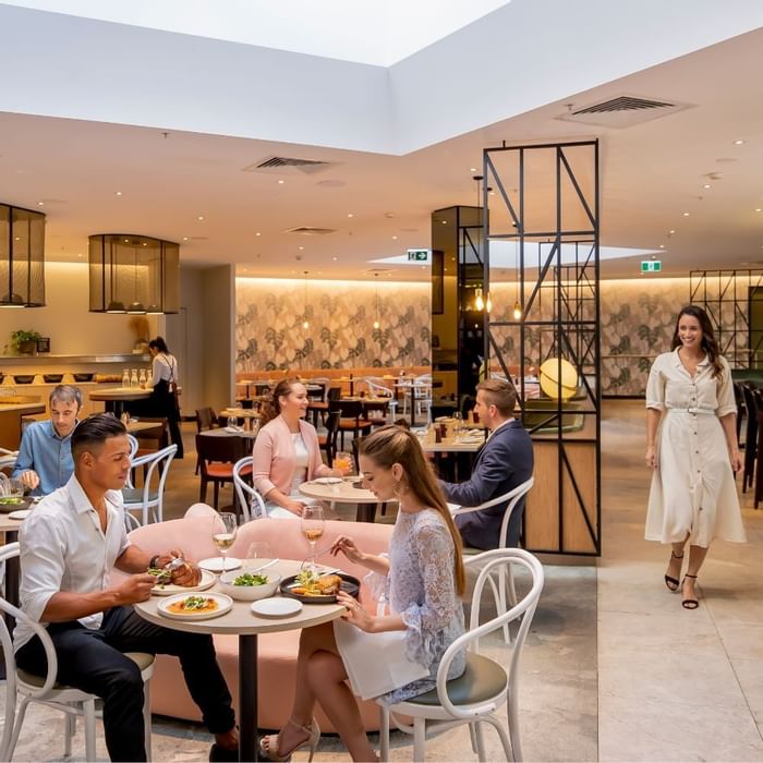 The Marke Kitchen featuring guests dining and staff serving at Novotel Sydney International Airport