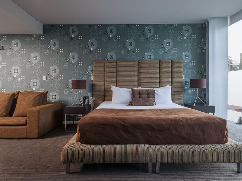 Large bed & sofa in the Master Suite at Gamma Hotels