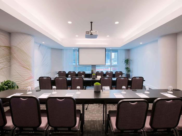 Classroom set-up with carpeted floors in Salon Drummond at Warwick Le Crystal Montreal
