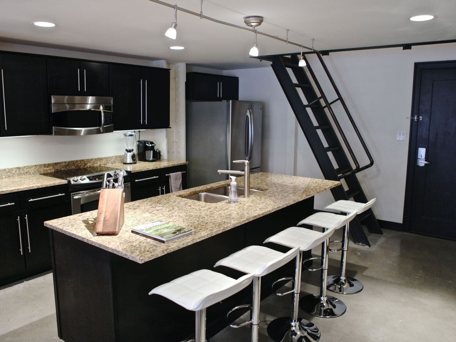 Kitchen with appliances in Unit N Terrace at The Mayo Hotel