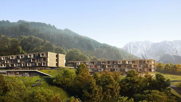 Distant exterior view of Falkensteiner Hotel Montafon and mountains