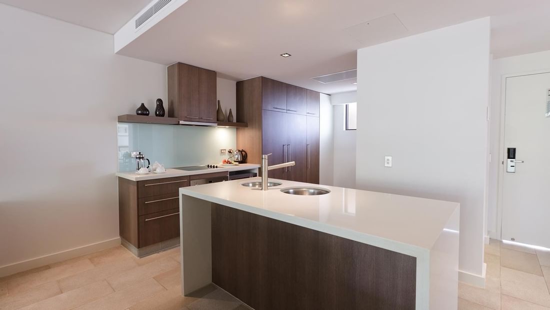 Kitchen in Two Bedroom at Pullman Palm Cove Sea Temple Resort