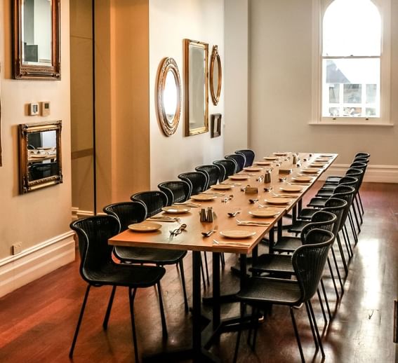 Dining table arrangement in Alcove with wooden floors at Melbourne Hotel Perth