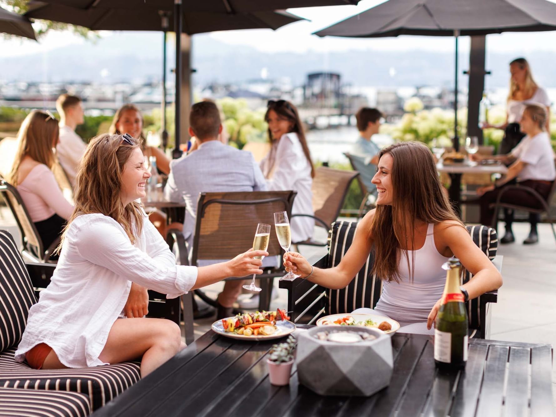 Ladies toasting wine in Maestro's at Manteo, Hotel Eldorado