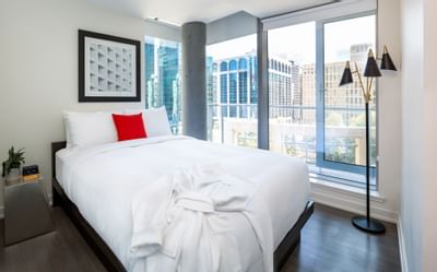 Bedroom arrangement with a city view at ReStays Ottawa