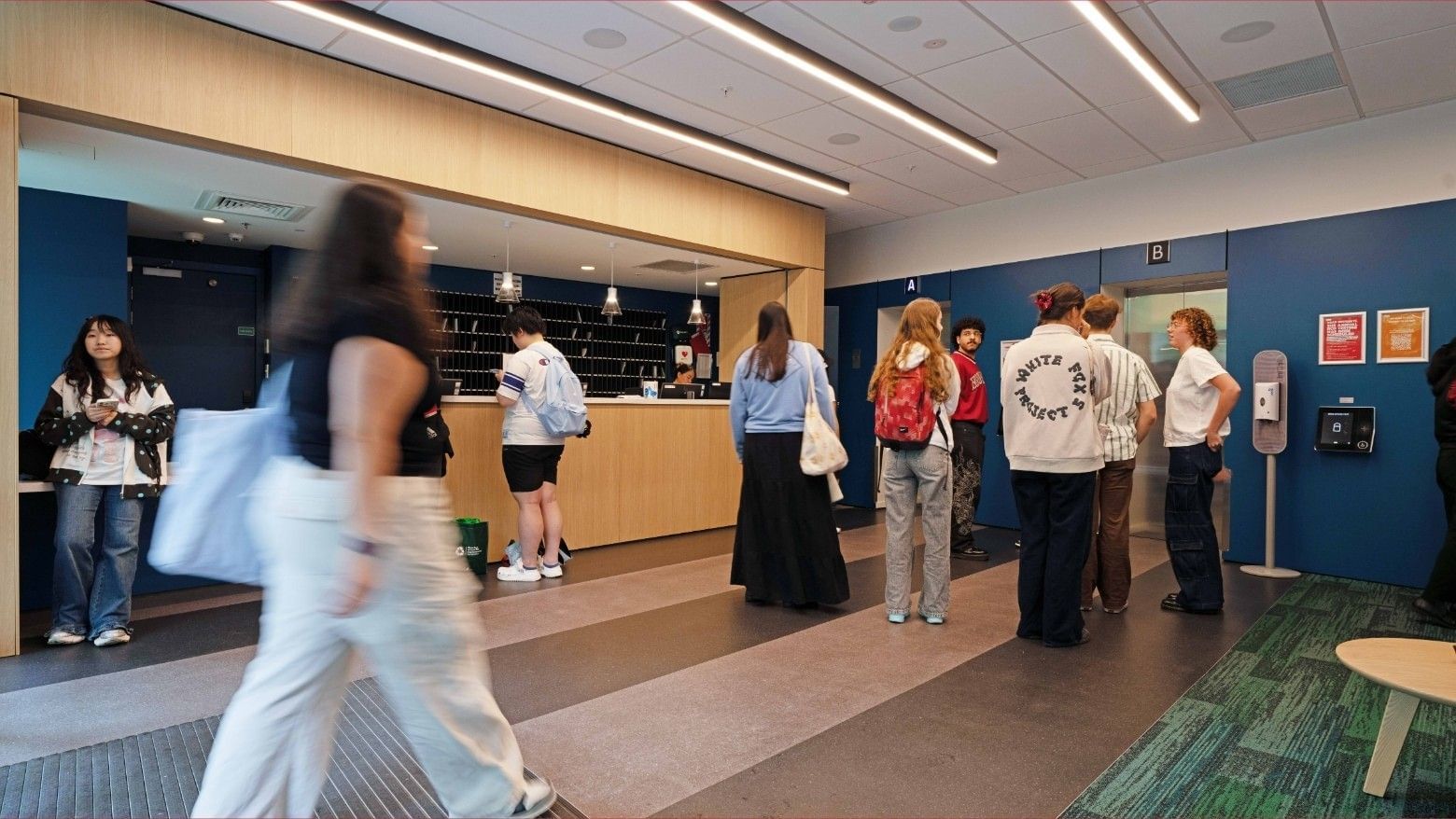People at the front desk of Mayoral Drive Student Accommodation.