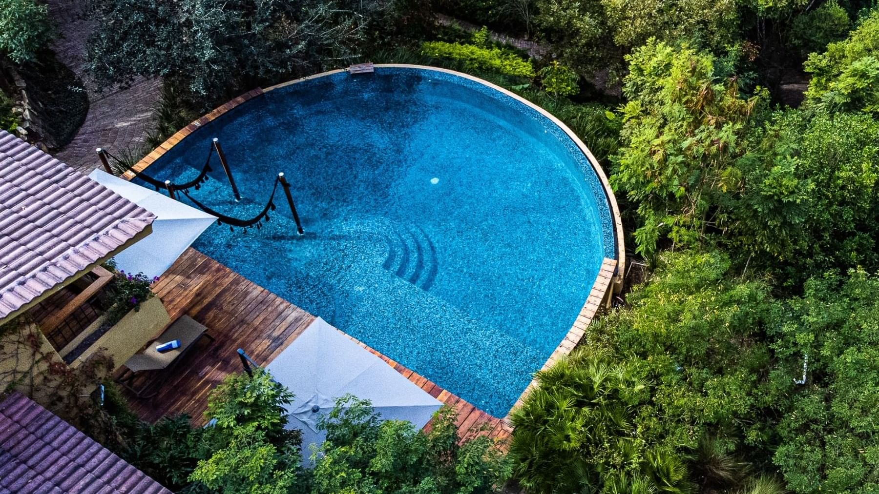 Aerial pool view of Gamma Rincón de Santiago with greeny surround
