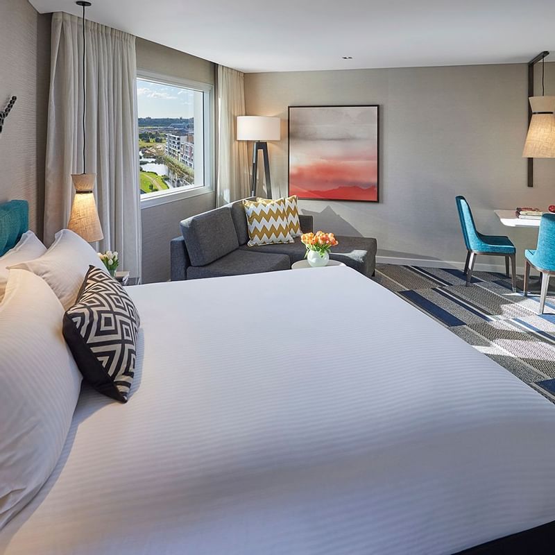 Bed & furniture in Spa Studio room at Crown Metropol Perth