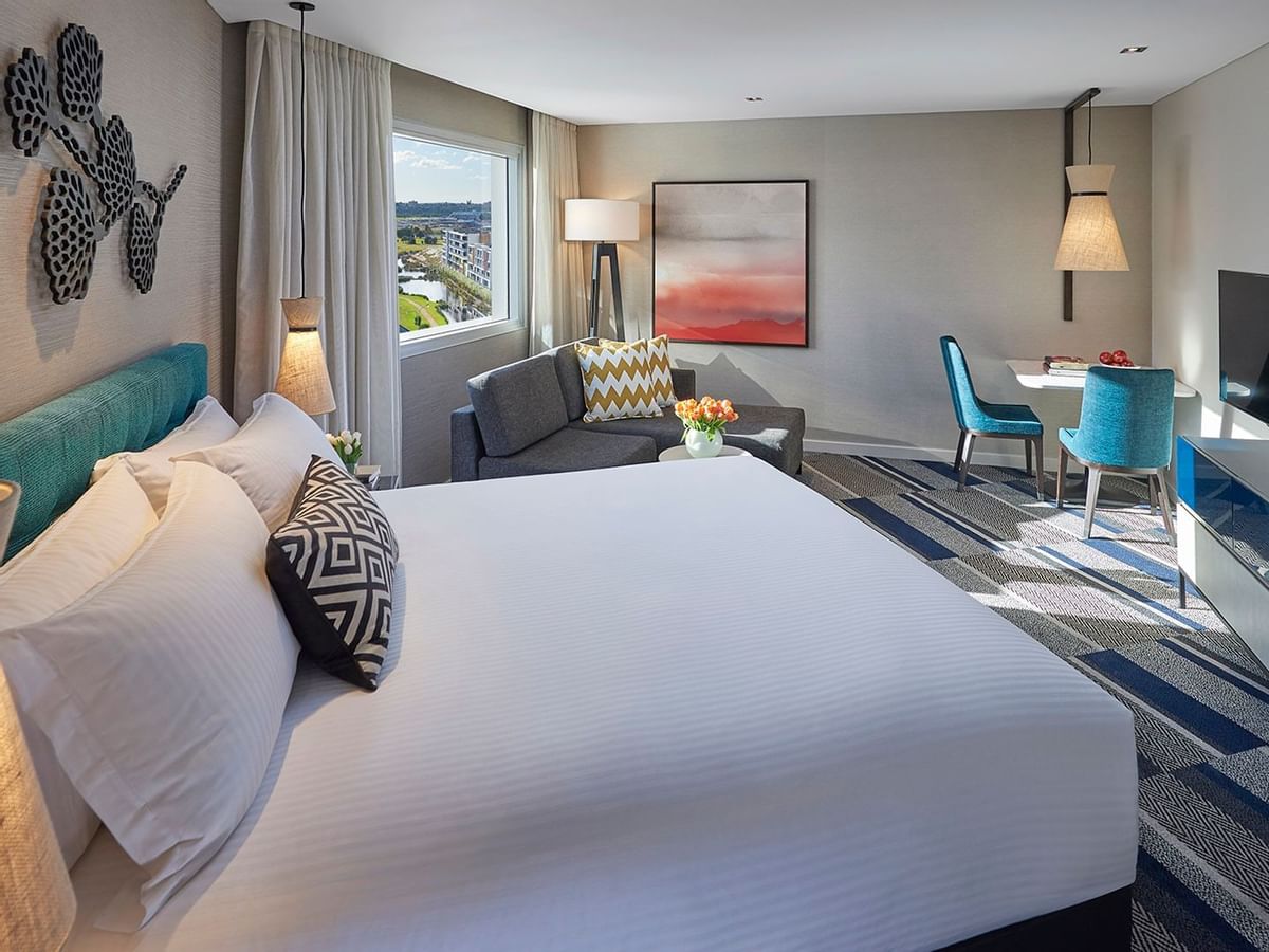 Bed & furniture in Spa Studio room at Crown Metropol Perth