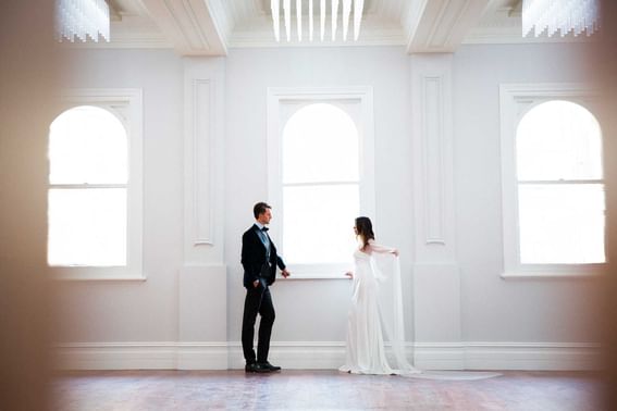 Wedded couple posing in an empty Hall at Melbourne Hotel Perth