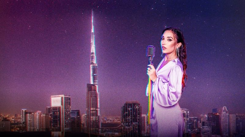 Singer on a rooftop with a microphone, overlooking the vibrant Dubai skyline at Paramount Hotel Midtown