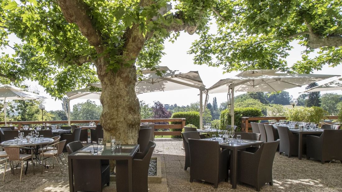 Outdoor terrace of the Pavillon at Domaine de Divonne Hotel in Divonne-les-Bains.