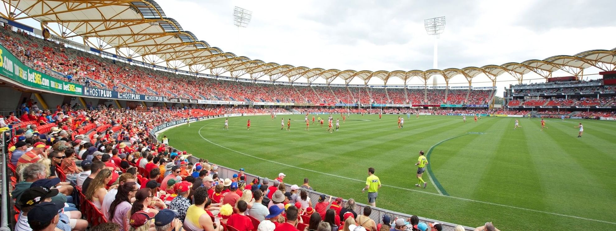 Stadium filled with fans watching a game during a Game Day Stay offer.