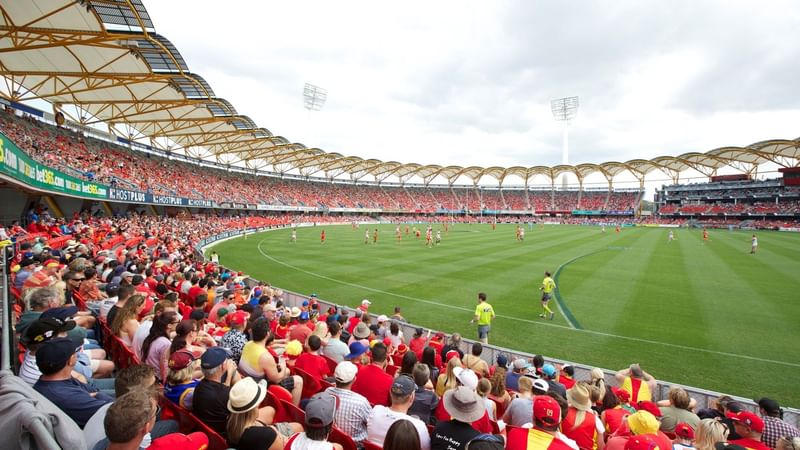 Stadium filled with fans watching a game during a Game Day Stay offer.