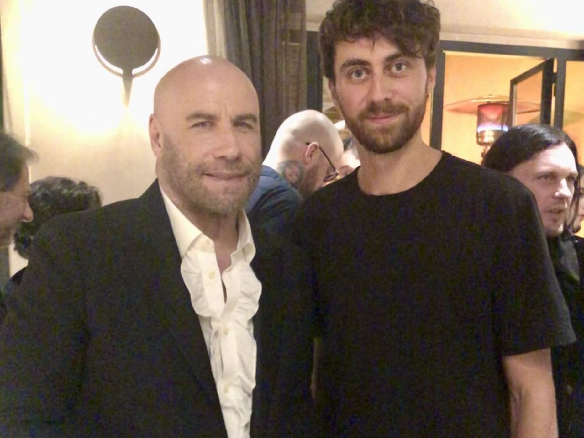 Two men posing to the camera at EMME Restaurant