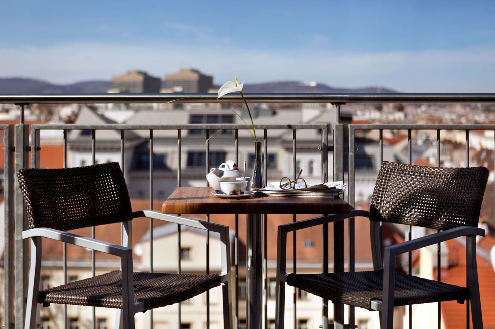 Seating area on balcony of a room at Flemings Selection Hotel