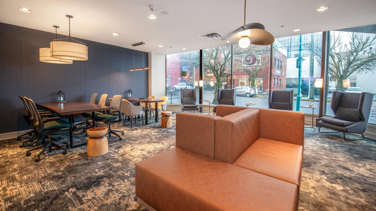 Brown sectional couch in modern lounge area at Coast Bastion Hotel.