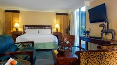 bed in room with cheetah and africa decorations