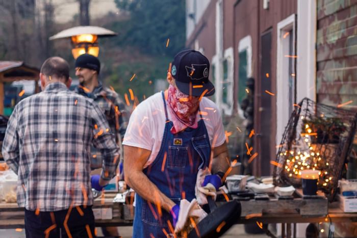 Chefs preparing meals at outdoors at Alderbrook Resort & Spa