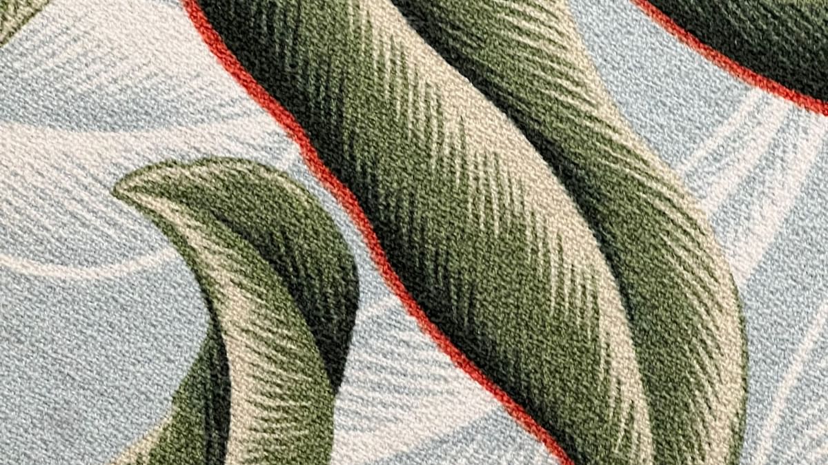 Green and red leaf pattern on a carpet at Tambua Sands Beach Resort in Sigatoka.