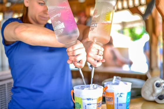 A bartender at Aloha Tiki Bar & Grill in Mystic Dunes Resort