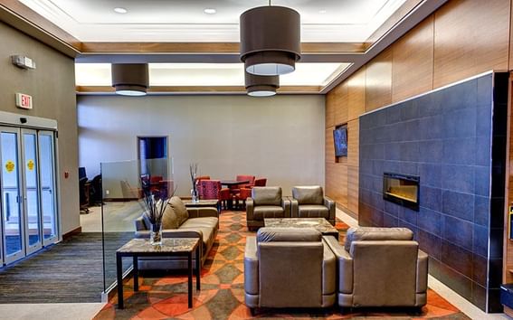 Spacious lobby area with cozy sofa at Fort McMurray Hotels