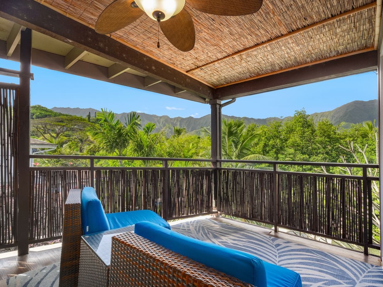 Balcony lounge area in One-Bedroom Suite Mountain View at Paradise Bay Resort