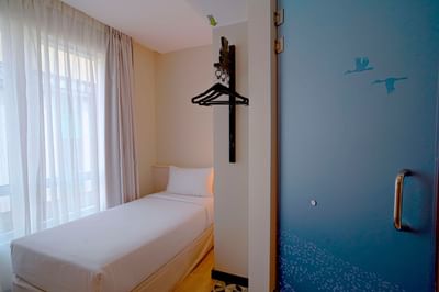 Cozy bed in Standard Single with sheer curtains at Cititel Express Kota Kinabalu