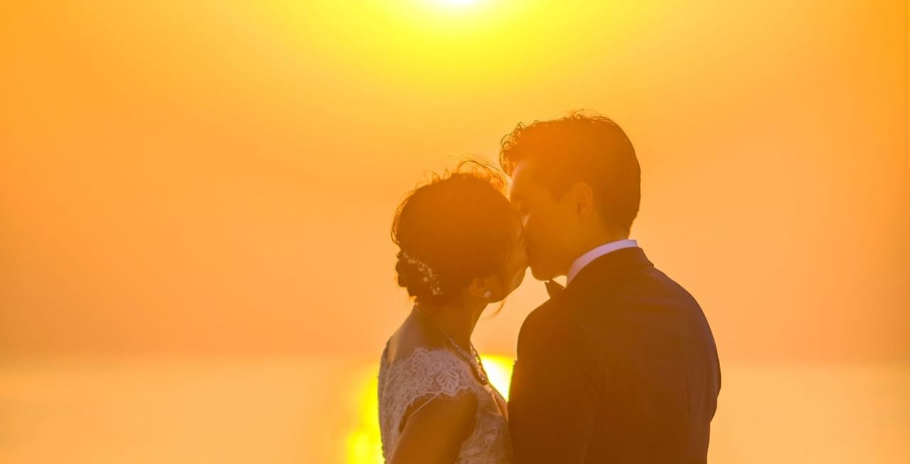 Couples under sunset