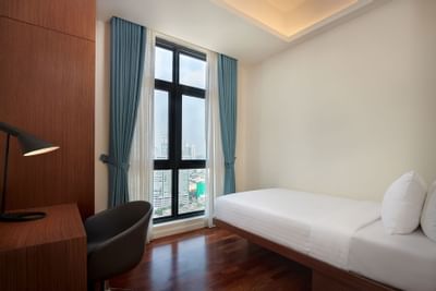 Bed & working desk in Duo Suite at Tribeca Serviced Suites