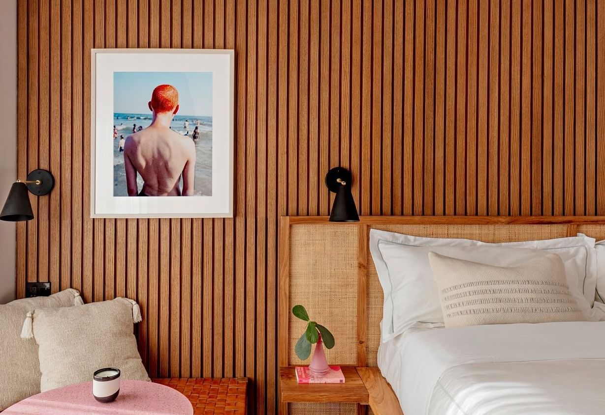 Bed side table & wall art in a room at The Rockaway Hotel