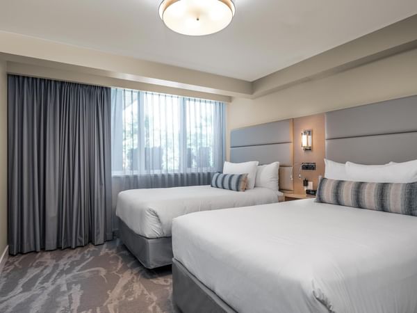 Two double beds in bedroom