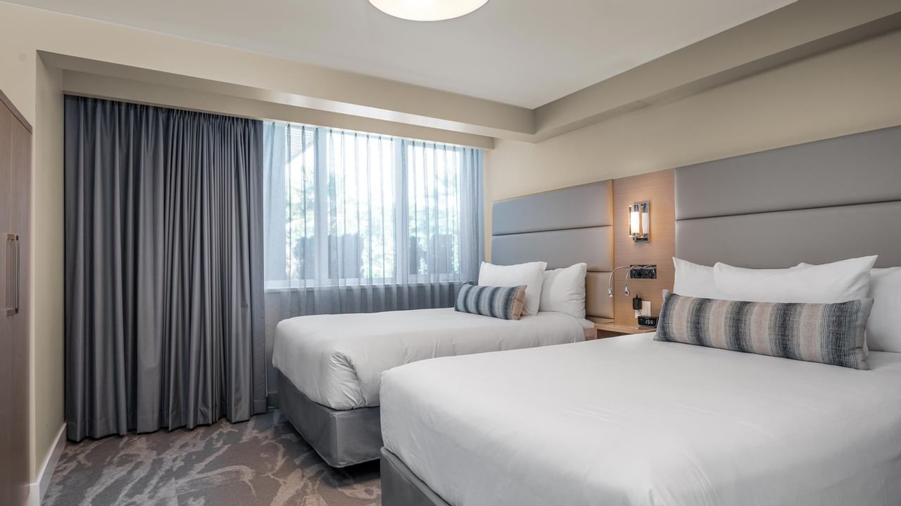 Two double beds in bedroom