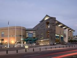 Exterior view of Te Papa Museum in the evening near James Cook Hotel Grand Chancellor