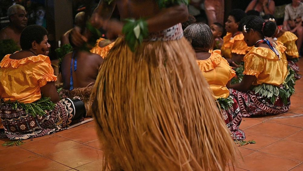 Group performing traditional Fijian dance at The Naviti Resort in Korolevu.