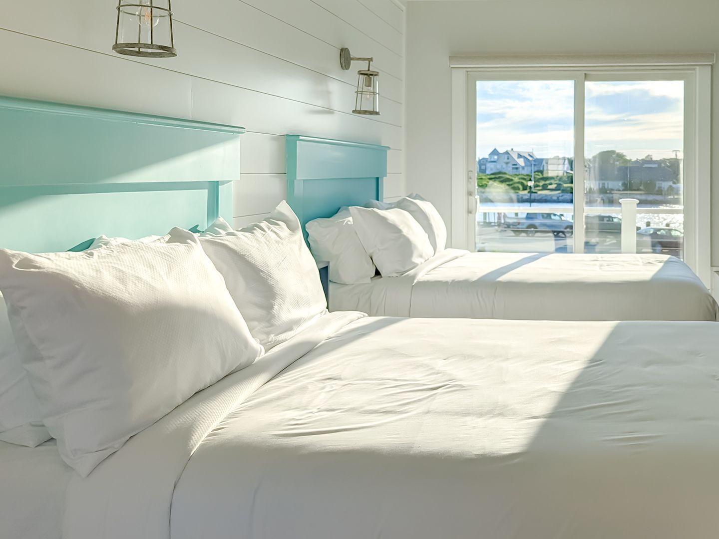 Twin beds in the Deluxe 2-Queen Ocean View at Falmouth Tides