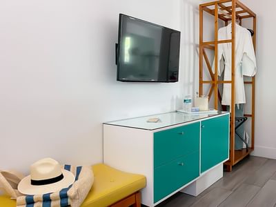 yellow bench, green Chester drawers and wardrobe in the Catalina