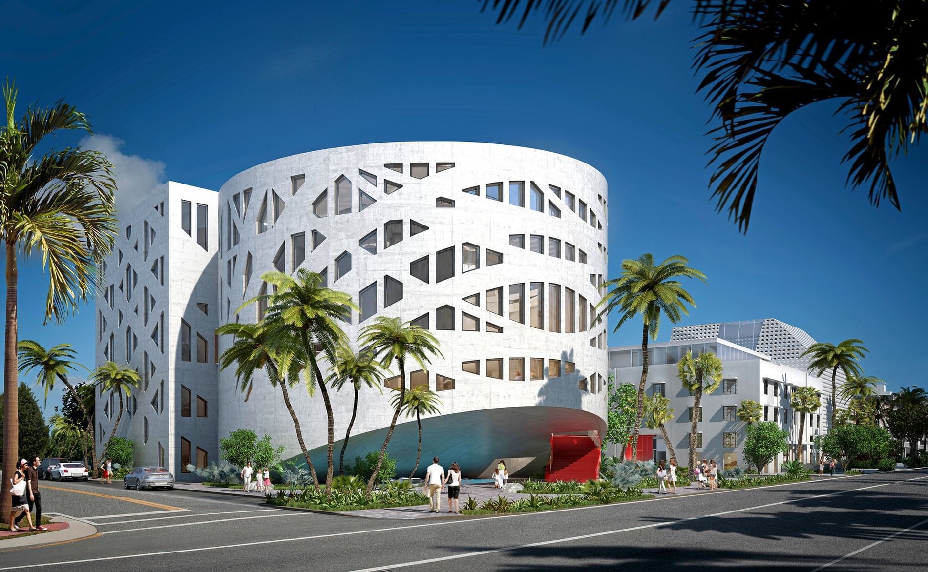 A modern white building with a unique curved facade and a red entrance
