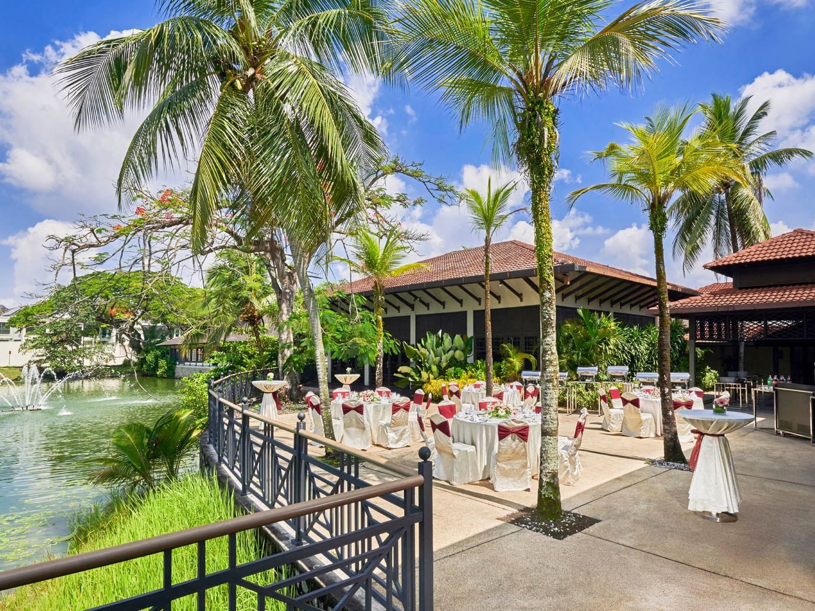 Banquet tables arranged by the terrace for an event in Topas at Saujana Hotel Kuala Lumpur