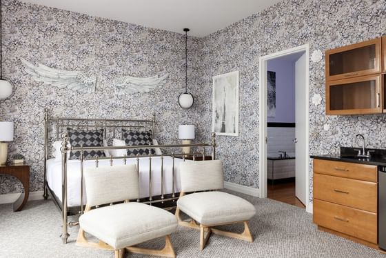 King bed, nightstand, two loungers & pantry in King Executive at Retro Suites Hotel