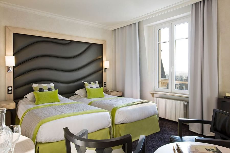 Twin beds in Escale Superieure at Le Grand Hôtel des Thermes