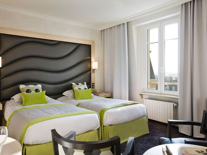 Twin beds in Escale Superieure at Le Grand Hôtel des Thermes