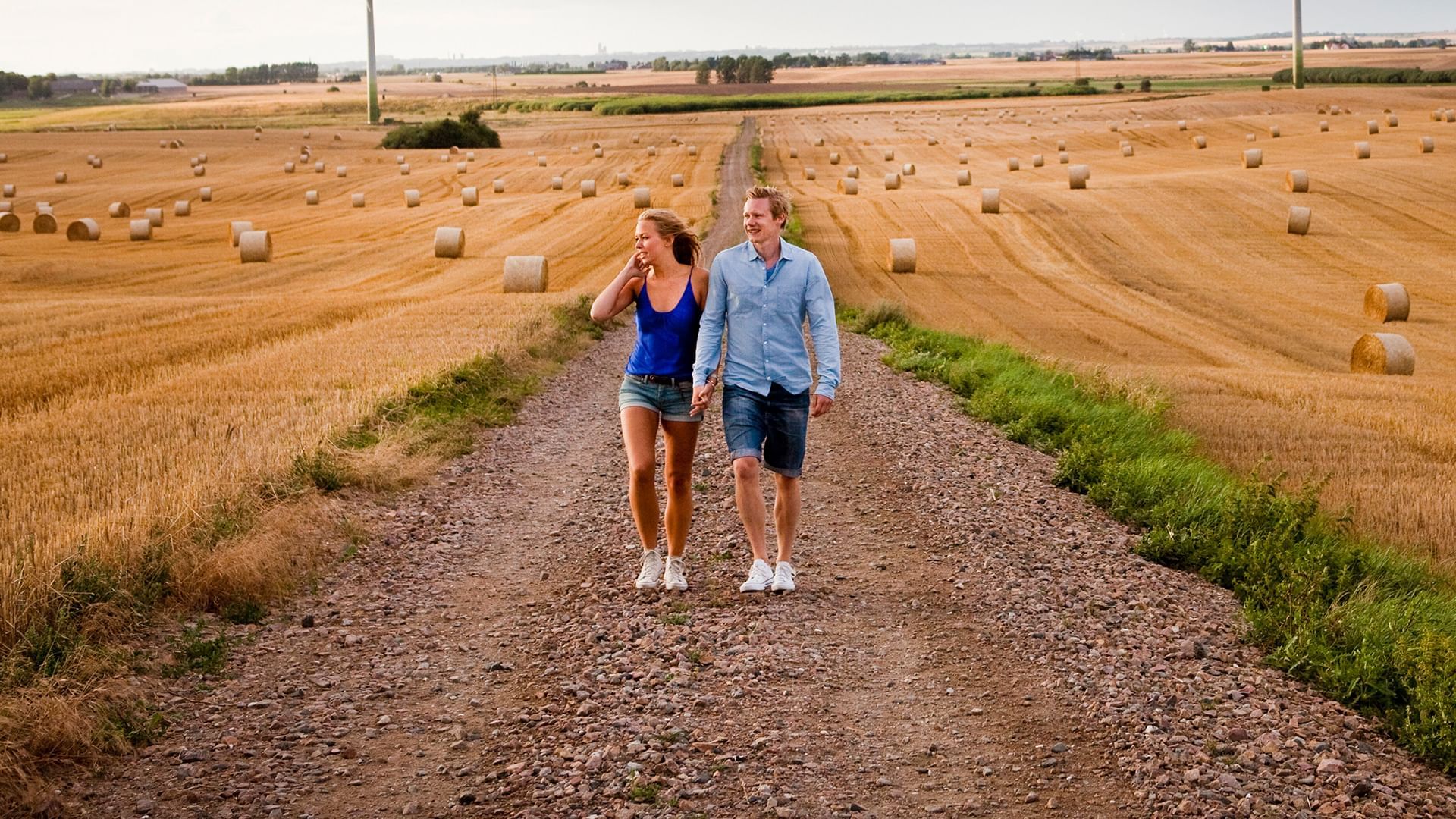 Couple hike on a mud road