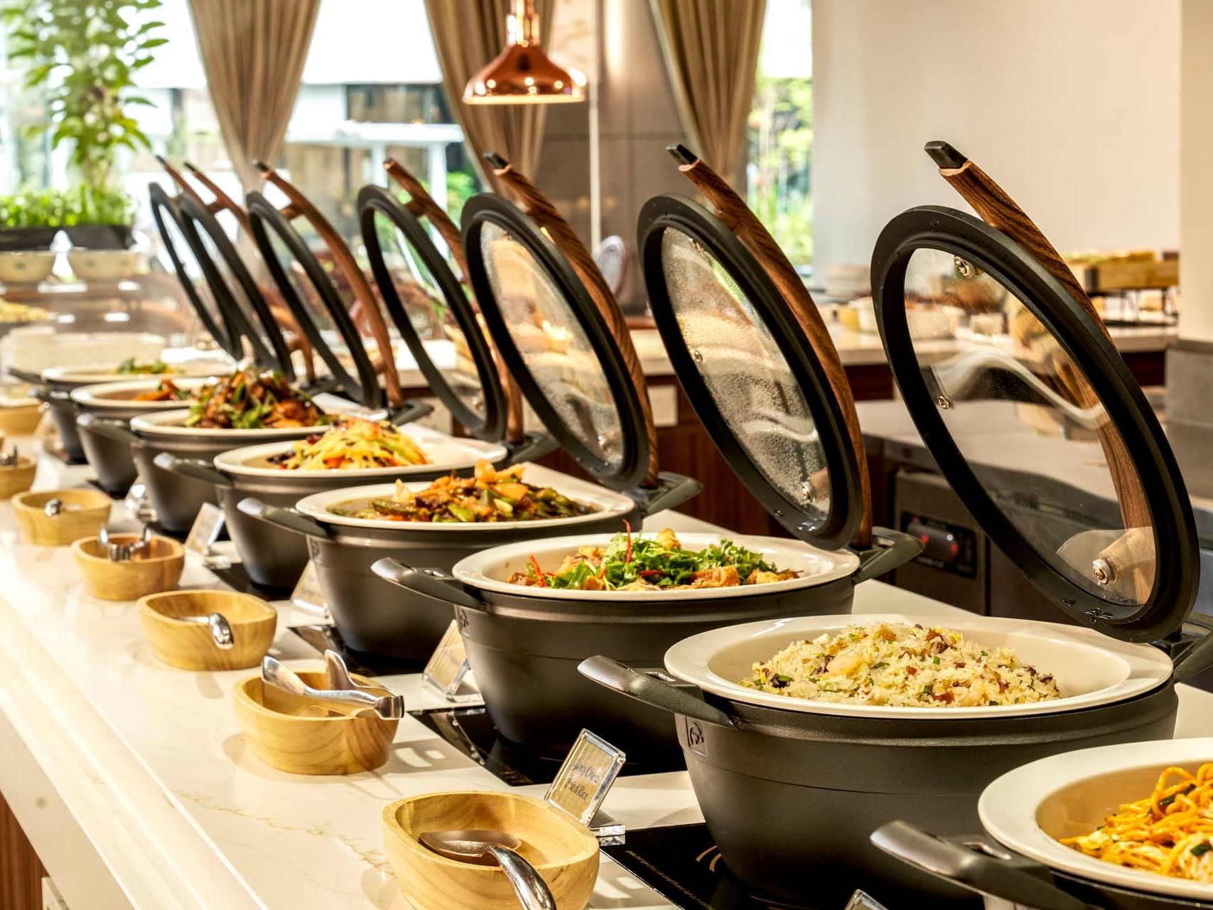 Elegant Taiwan Porridge Buffet display with black pots and glass lids at Crystal Cafe, Orchard Grand Court