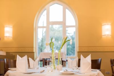 Set Table in front of window at Leo´s Bistro in Hotel Collegium Leoninum, Bonn