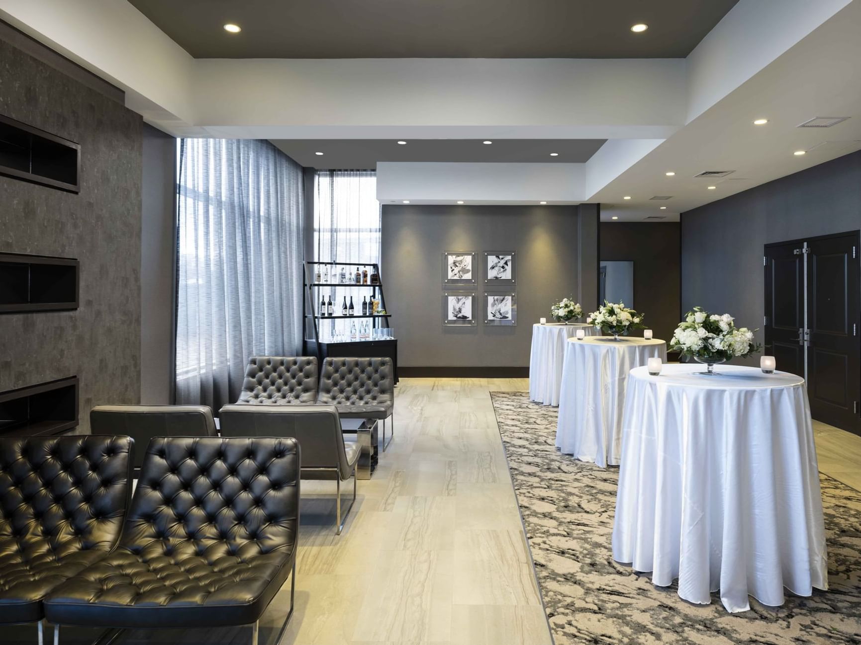 waiting area with small bar tables and seating