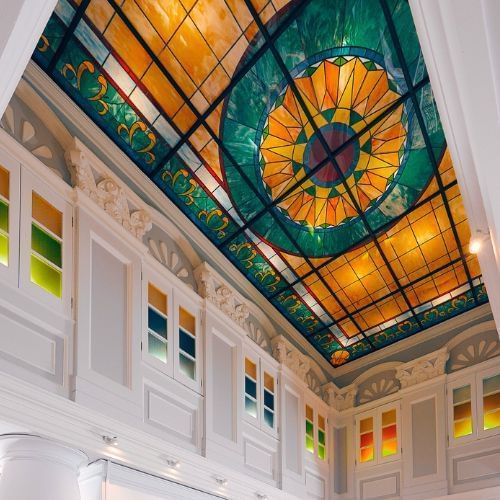 Vibrant stained glass ceiling in the lobby at Paradox Singapore