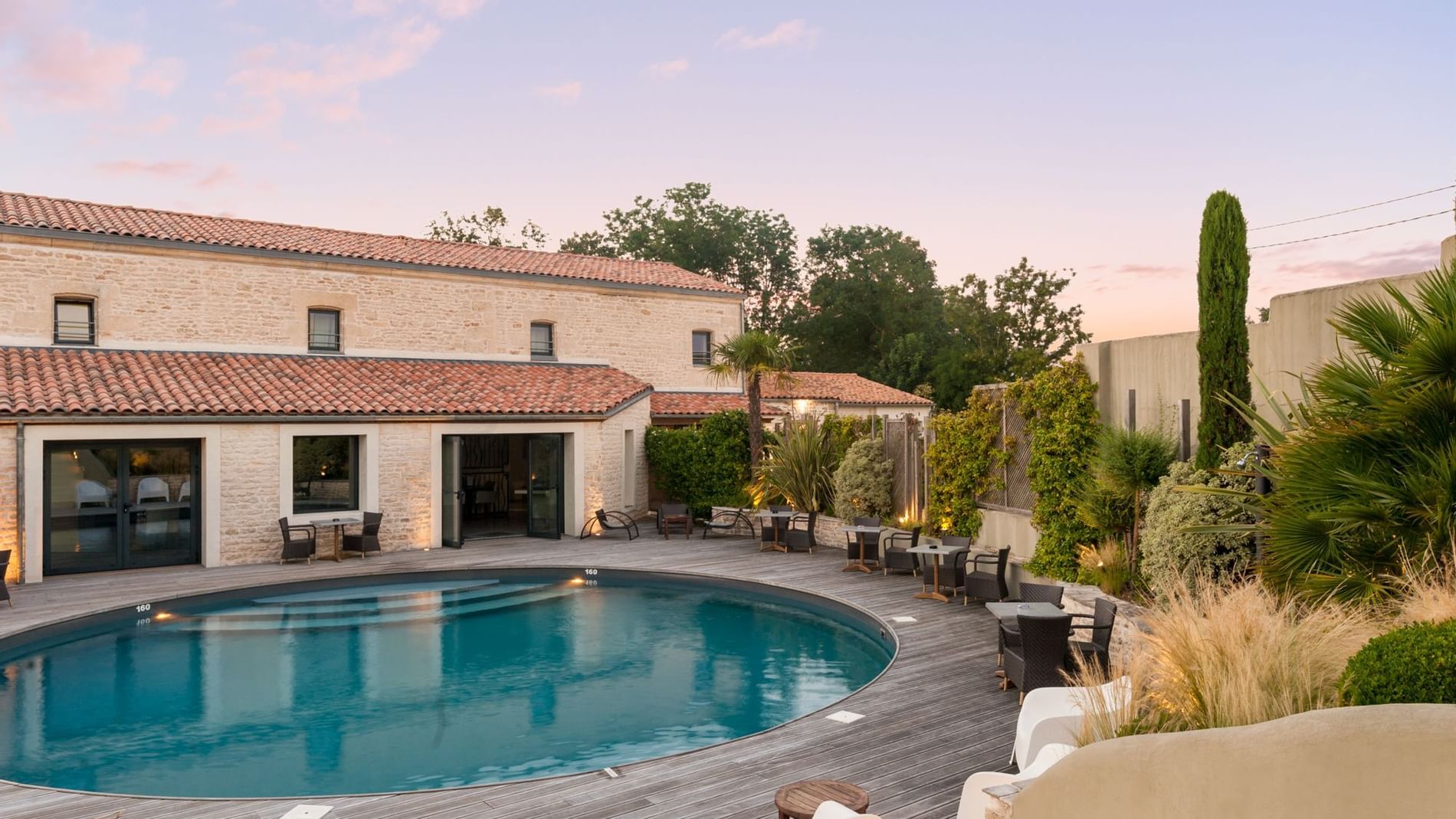 Pool with seating area at Hotel La Grange
