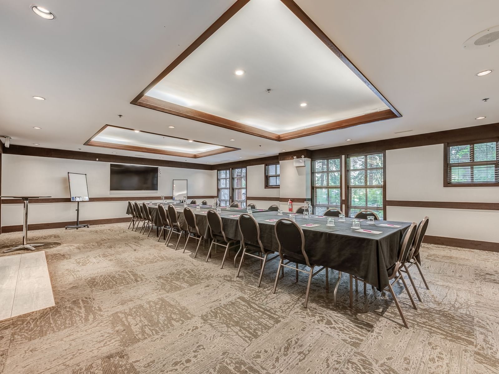 Table arrangement with TV in a Conference Room at Blackcomb Springs Suites